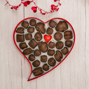 a pound red heart-shaped box with a red satin box is filled with exceptional assorted chocolates. Choose all milk chocolate or a mix of milk and dark chocolates.