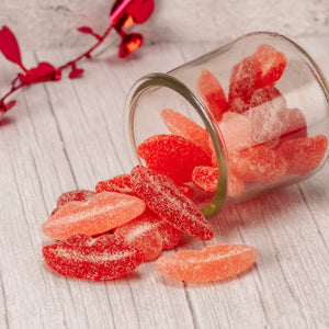 a half pound bag of sour sugar-sanded gummi lips, flavored cherry, strawberry and watermelon.