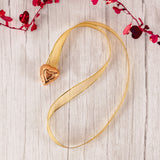 2 gold foil dark chocolate hearts together on festive ribbon makes a lovely necklace to wear for the holiday! 