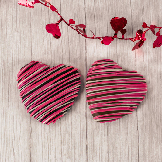 a wonderful marshmallow heart treat dipped in smooth milk chocolate or rich dark chocolate and drizzled with pink and white icing.