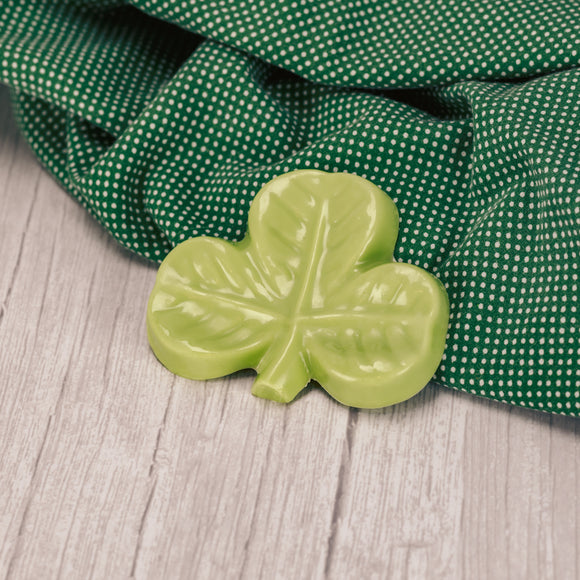 a shamrock in green coating (like white chocolate), bagged and tied with a festive ribbon bow.