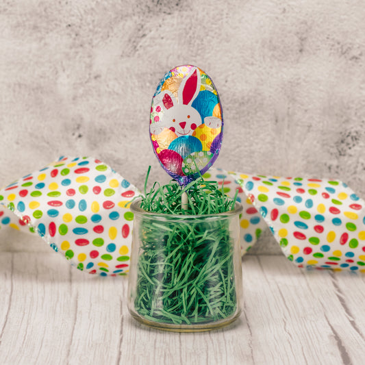 a milk chocolate egg shaped sucker wrapped in foil with a cute bunny on it. Assorted colors and designs