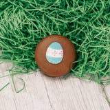 An oreo cookie covered in milk or dark chocolate with a sugar Easter decoration on top. Individually packaged.