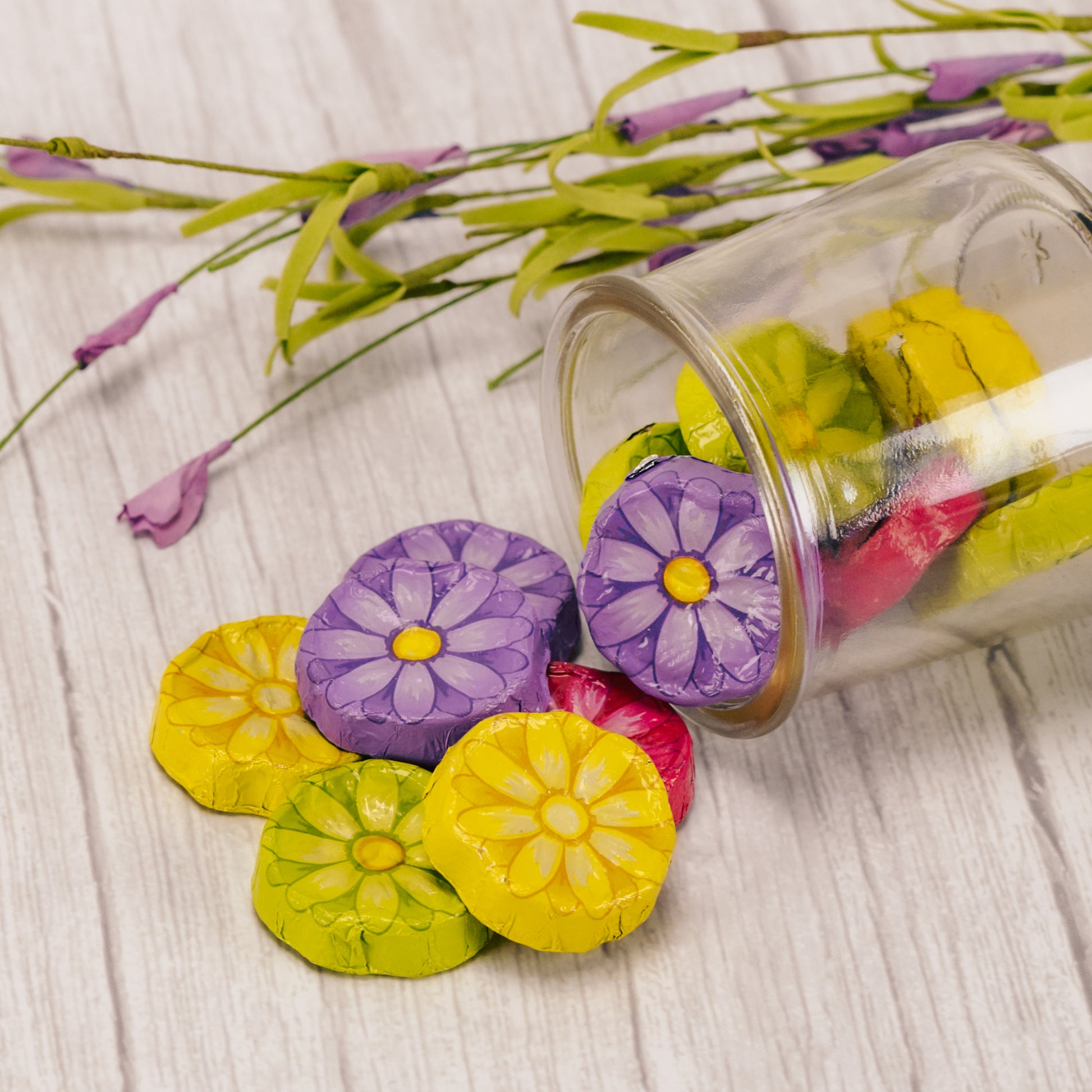 half pound bag of milk chocolate wrapped in bright daisy flower foil