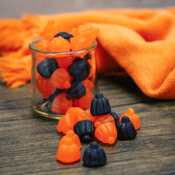 Black and orange gummi pumpkins flavored grape and orange.