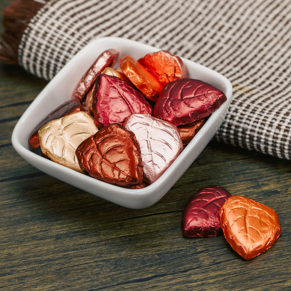 Dark chocolate leaves wrapped in foil fall colors.