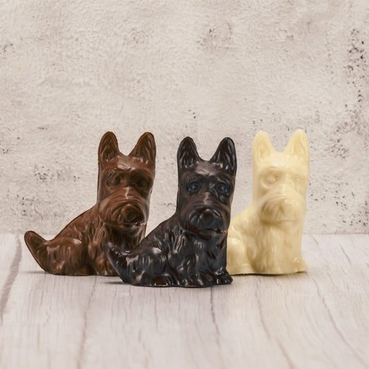 A scottie dog in milk chocolate, dark chocolate or white coating.