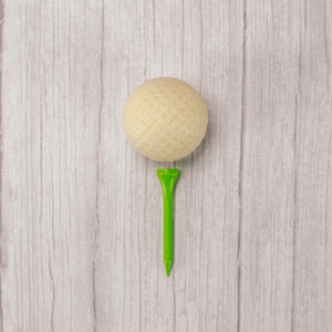 Solid white coating golf ball packaged with a real golf tee.