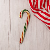 a large sugar cookie candy cane filled with white icing.