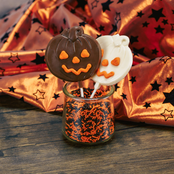 Milk chocolate or white coating pumpkin on a sucker stick. With orange icing for eyes, nose and smile.
