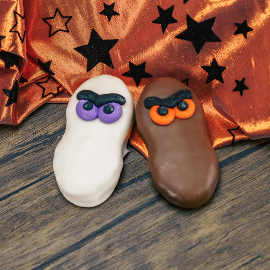 A Nutter Butter Cookie dipped in white coating or milk chocolate with a set of sugar eyes