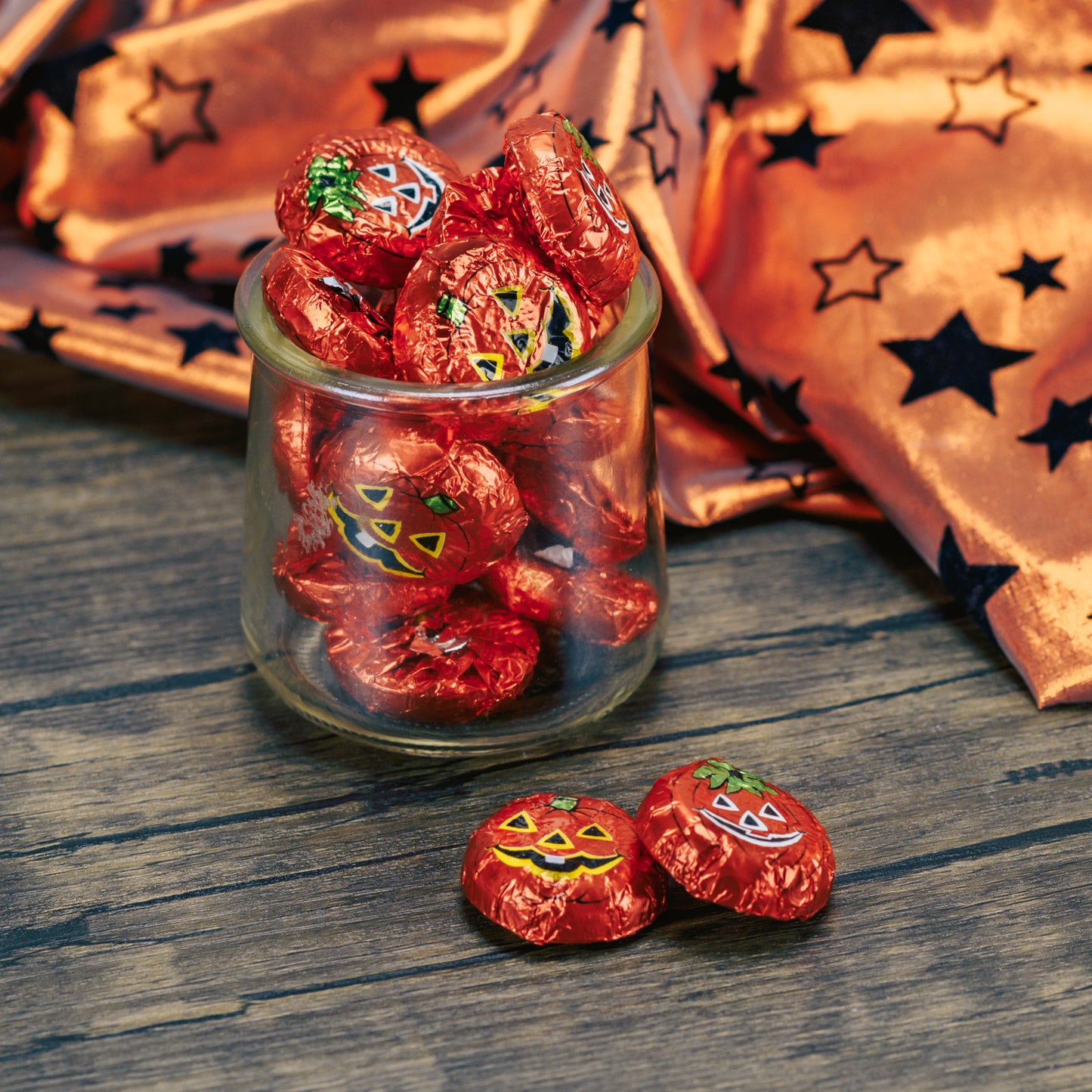 flat discs of milk chocolate wrapped in pumpkin face foil. Comes in half pound bags.
