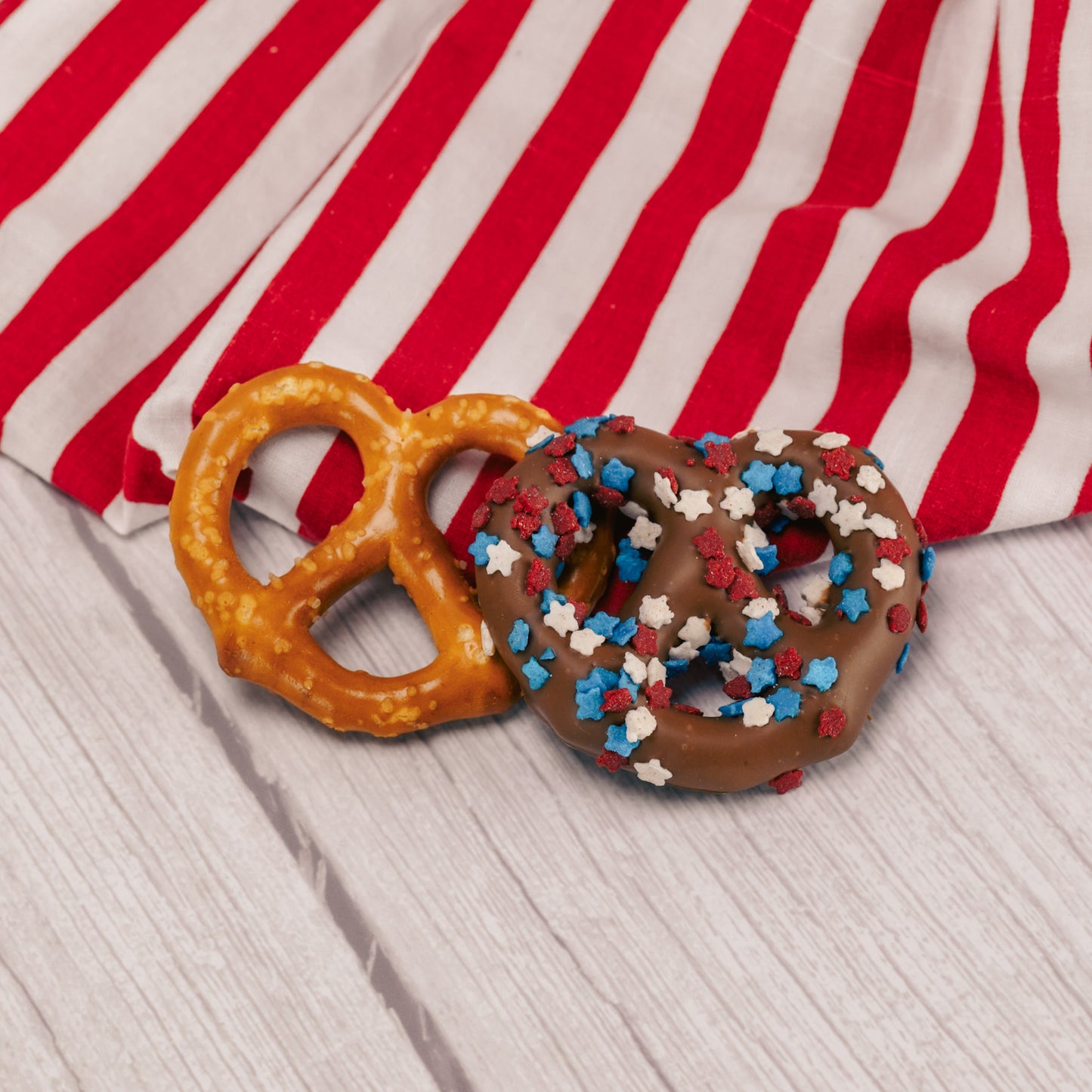 A jumbo pretzel covered in smooth milk chocolate sprinkled with red, white and blue stars, Individually packaged.