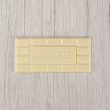  white coating molded into a bar that says "Marie's"
