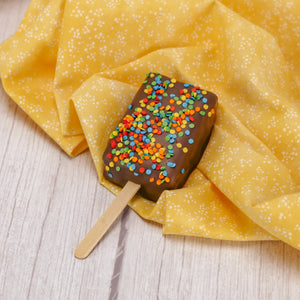 chewy rice krispie treat on a popsicle stick covered in smooth milk chocolate with colorful summer sprinkles on top. Individually packaged. 