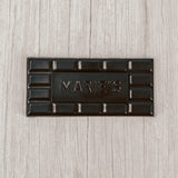 dark chocolate molded into a bar that says "Marie's"
