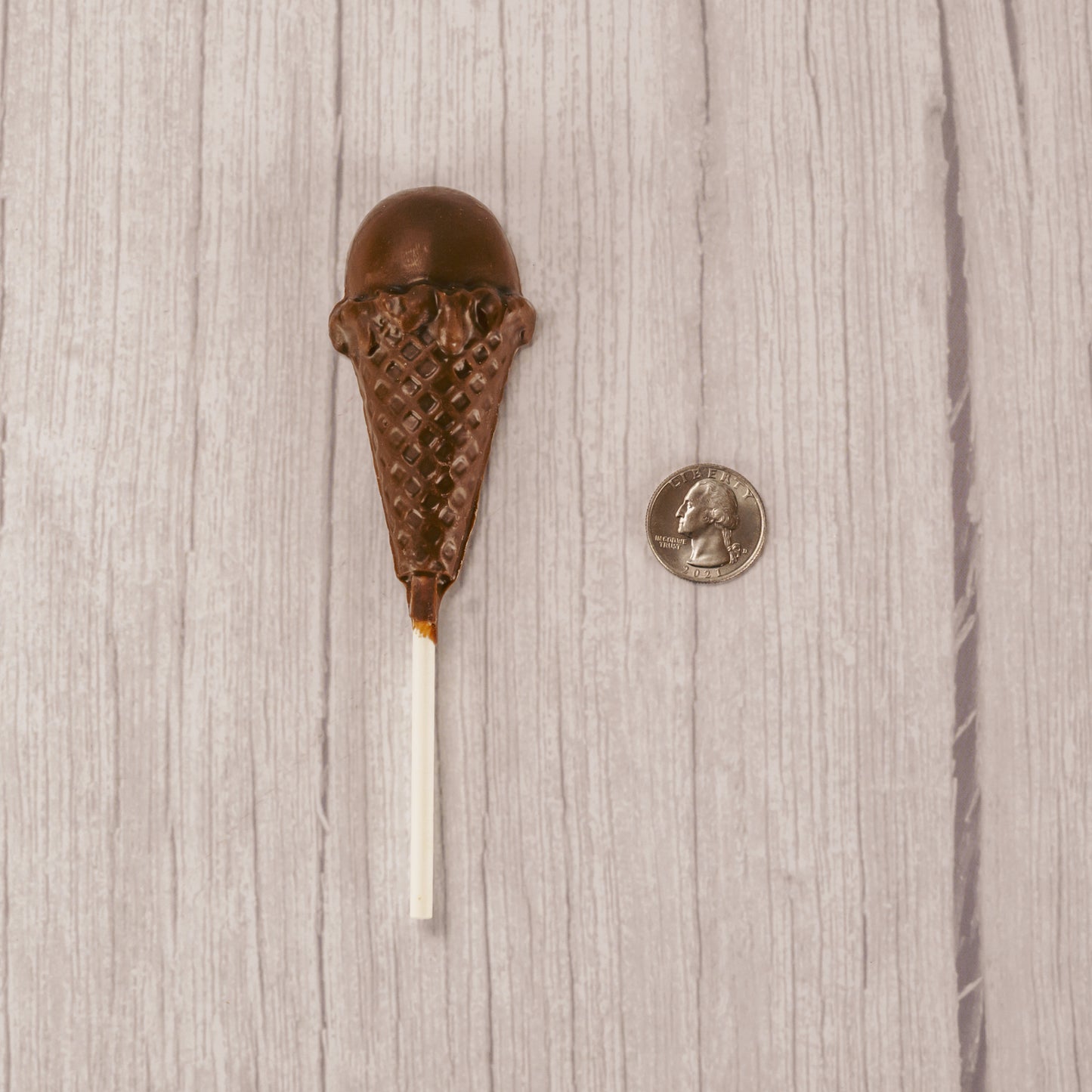 A milk chocolate ice cream cone sucker on a stick. Individually packaged.