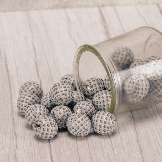 bite size milk chocolate balls wrapped in golf ball foil in a half pound bag.