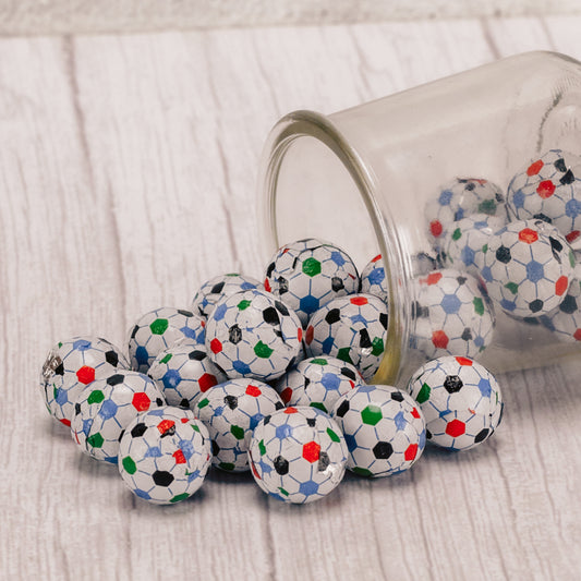 bite size milk chocolate balls wrapped in soccer ball foil in a half pound bag.