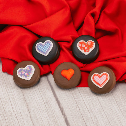 Milk or dark chocolate Oreo cookies with a sugar heart decoration on top