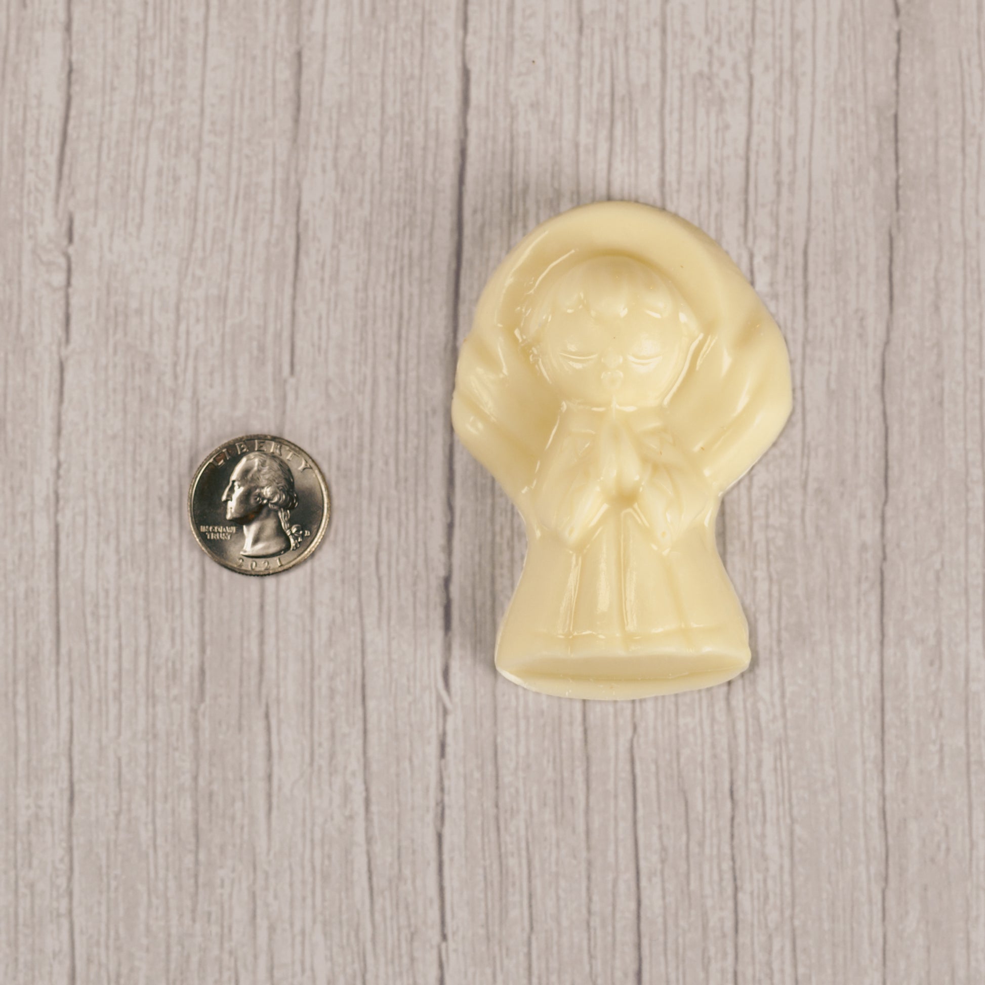 Solid chocolate angel in white coating.