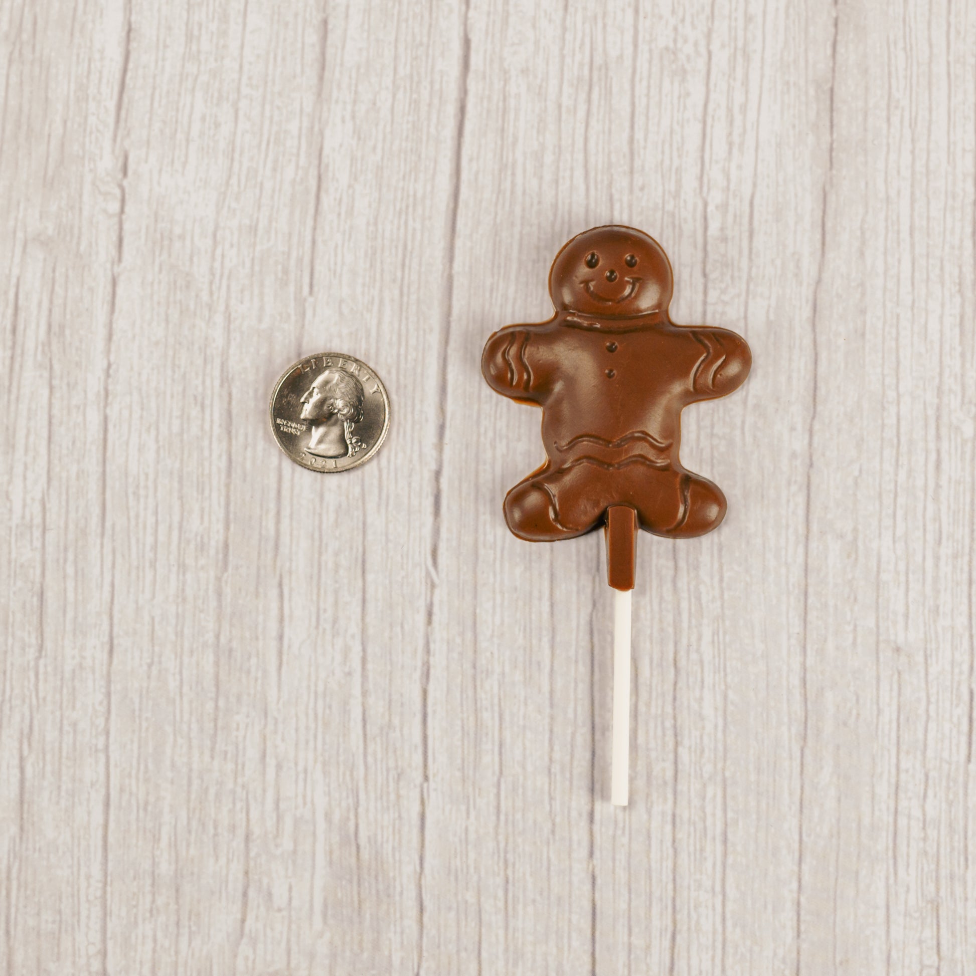 Milk chocolate gingerbread man on a sucker stick
