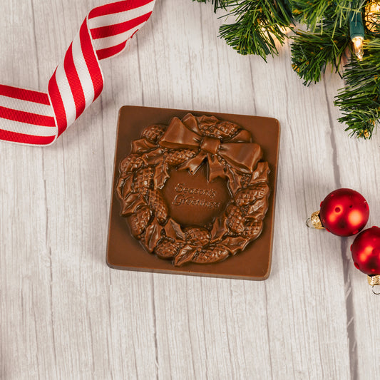 solid milk chocolate square with a wreath and "Season's Greetings"
