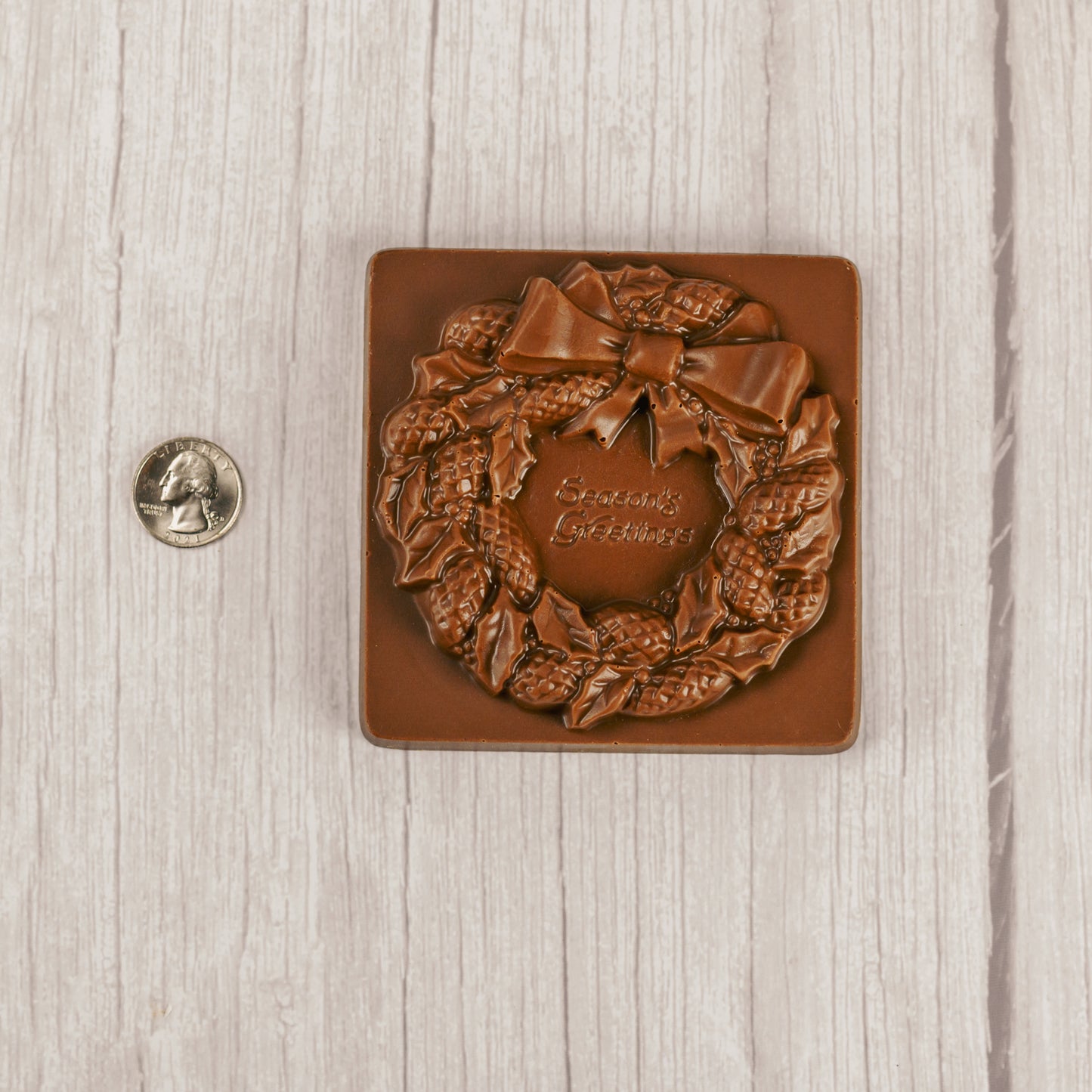 solid milk chocolate square with a wreath and "Season's Greetings"