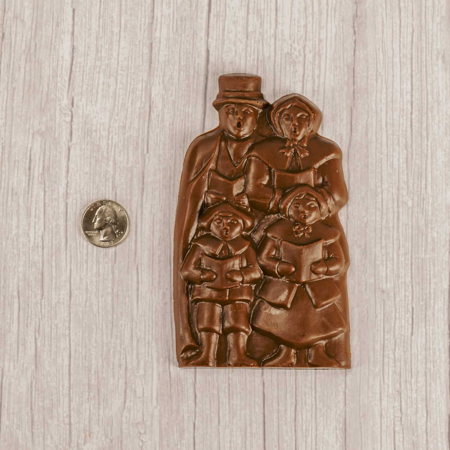 Solid milk chocolate singing carolers.