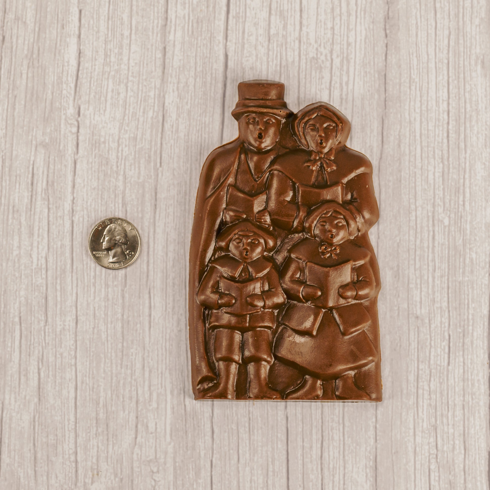 Solid milk chocolate singing carolers.