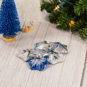 Silver and blue foil wrapped milk chocolate snowflake.