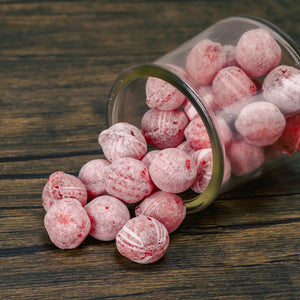 Hard, round cinnamon balls are slightly dusted and are packaged in half pound bags.
