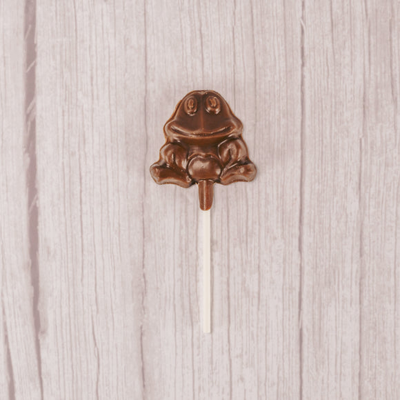 small frog on a stick in milk chocolate, placed in a cello bag and tied.
