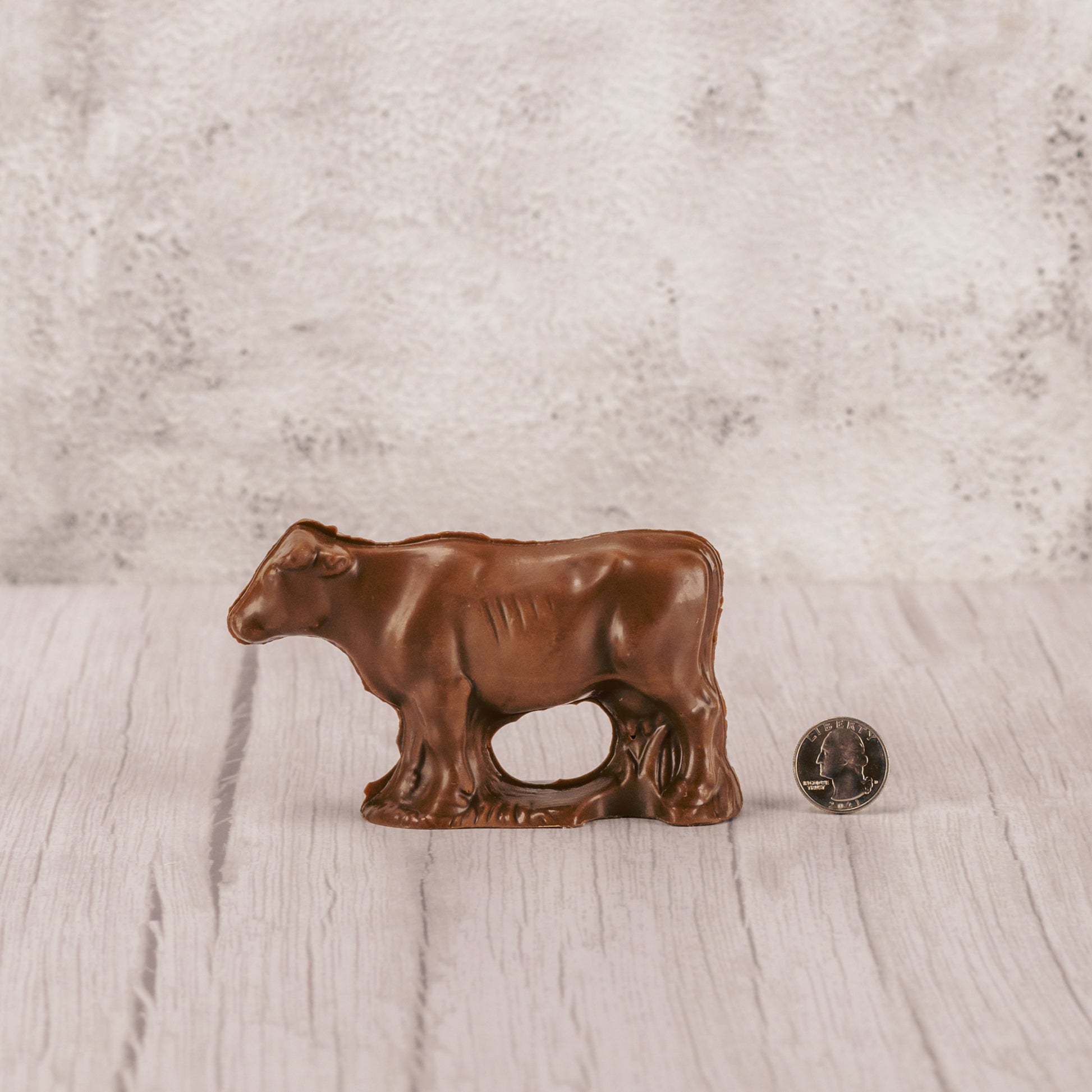 a standing solid milk chocolate cow