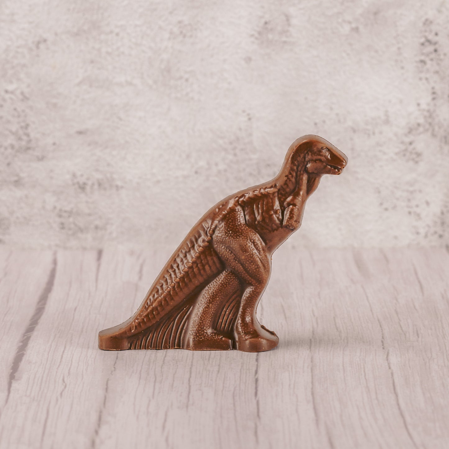 a standing milk chocolate dinosaur