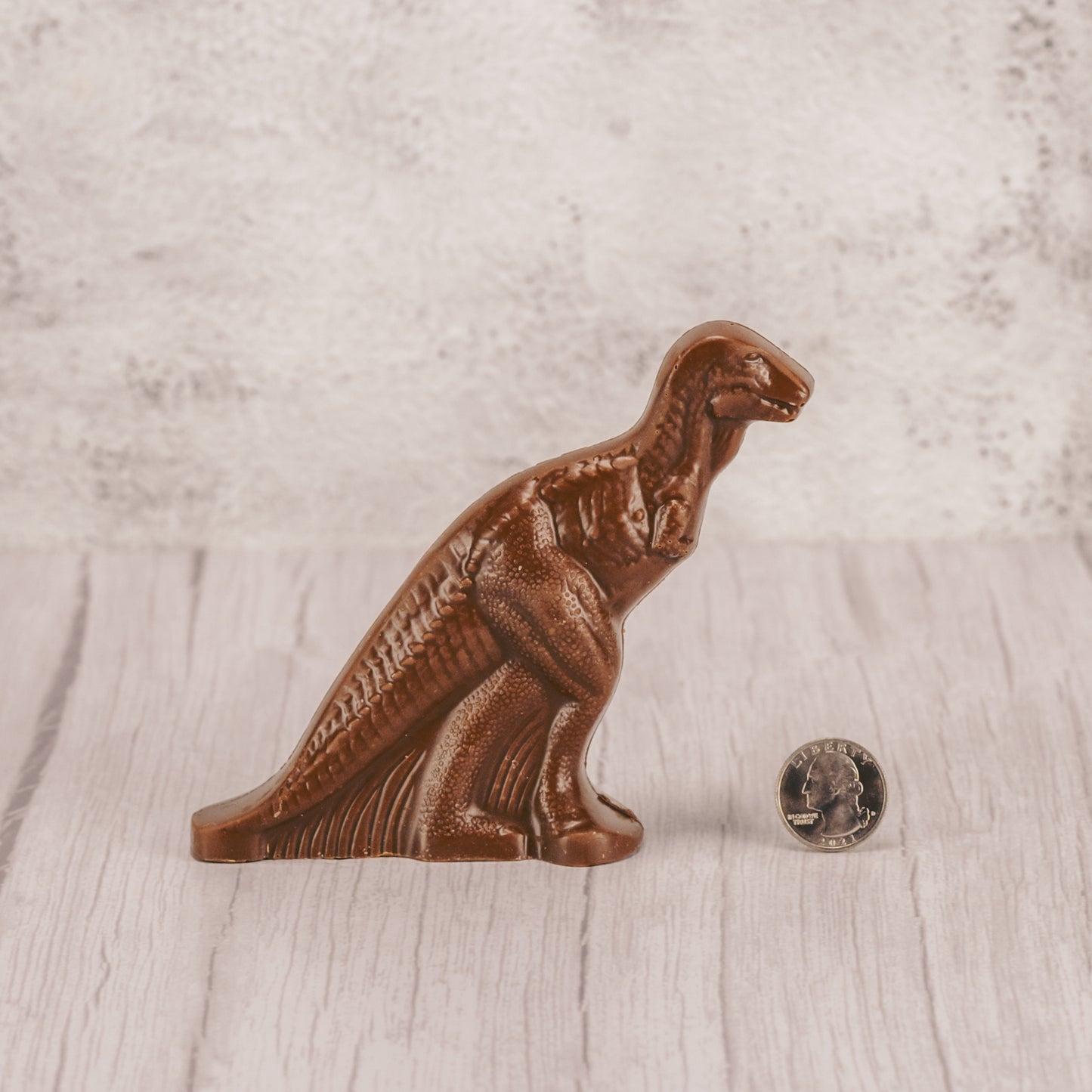 a standing milk chocolate dinosaur