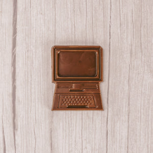 a flat computer mold in milk chocolate.