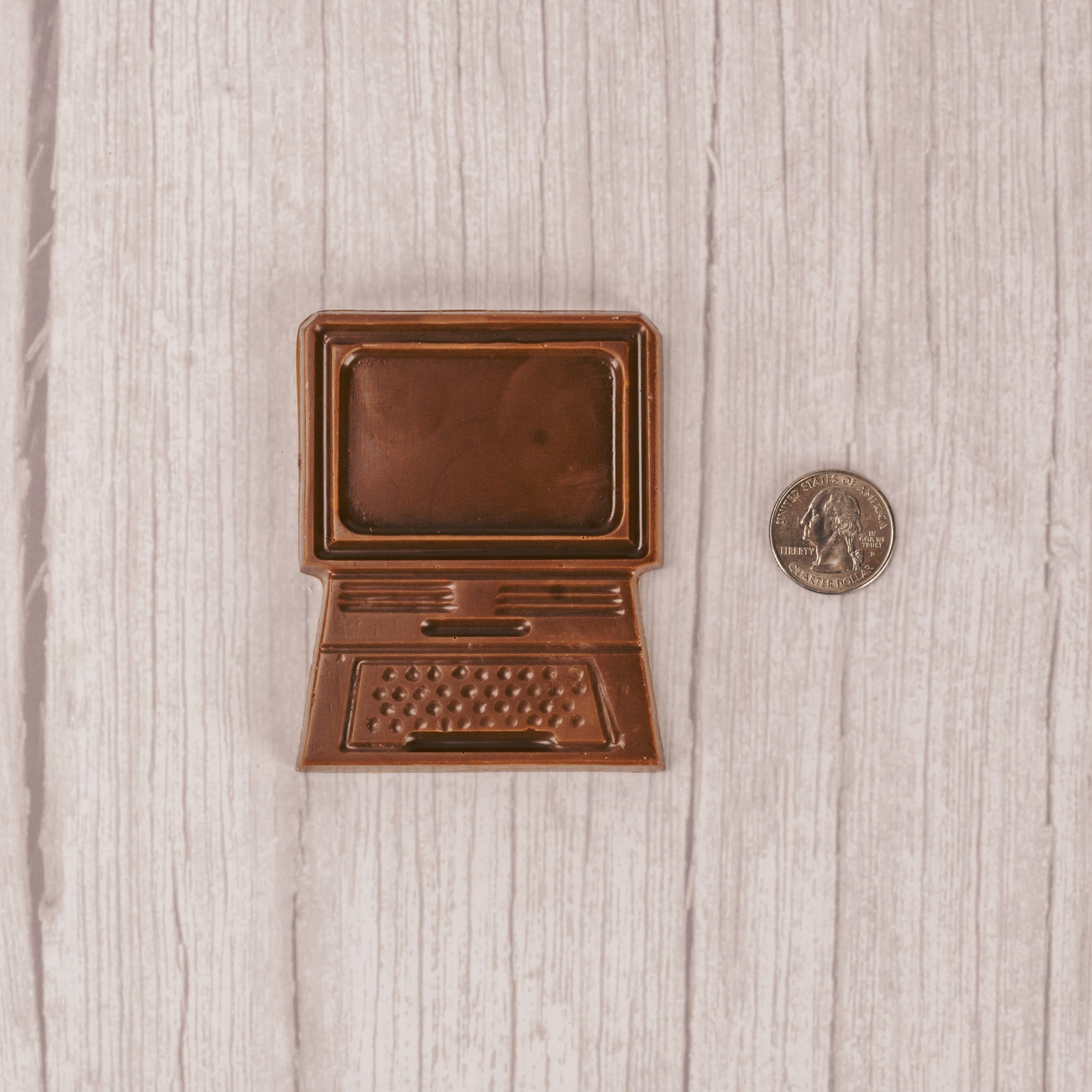 a flat computer mold in milk chocolate.
