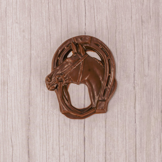 a horse shoe and horse in milk chocolate