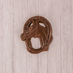 a horse shoe and horse in milk chocolate