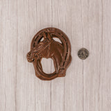 a horse shoe and horse in milk chocolate