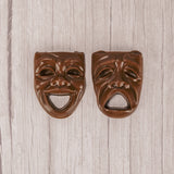 a drama mask smiling or frowning in milk chocolate.