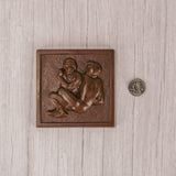 A square shape of two wrestlers in milk chocolate.