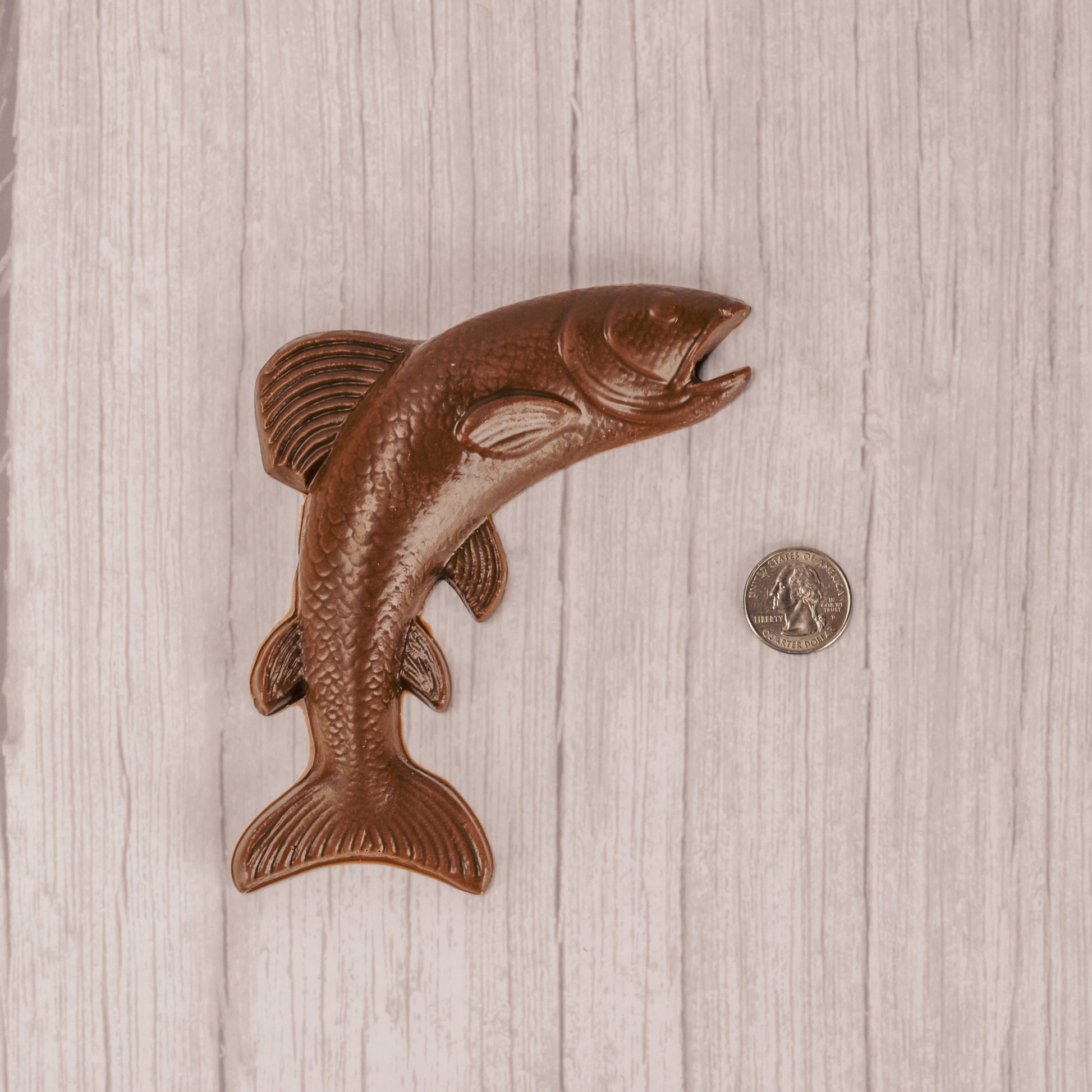A large milk chocolate fish packaged in a clear cello bag.