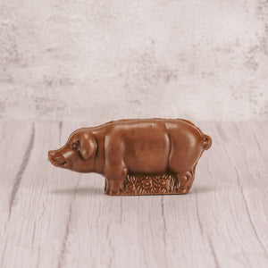 a milk chocolate solid pig