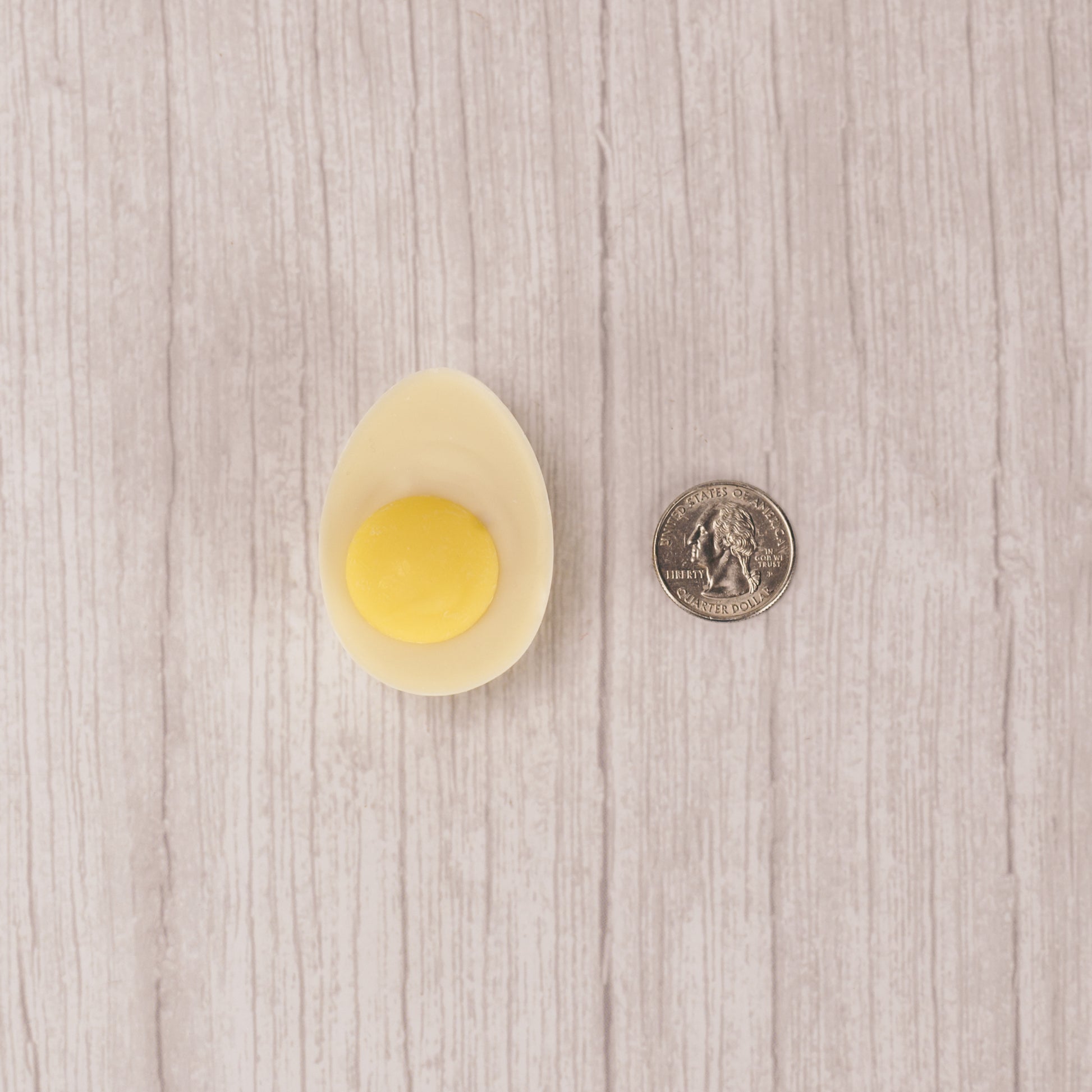 white coating with a dollop of yellow coating in the center to look like a real deviled egg!