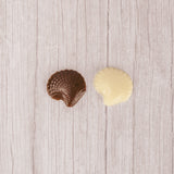 bite-sized seashell in milk chocolate or white coating. Individually wrapped.