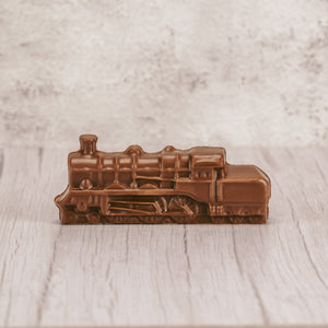 a small milk chocolate train in milk chocolate