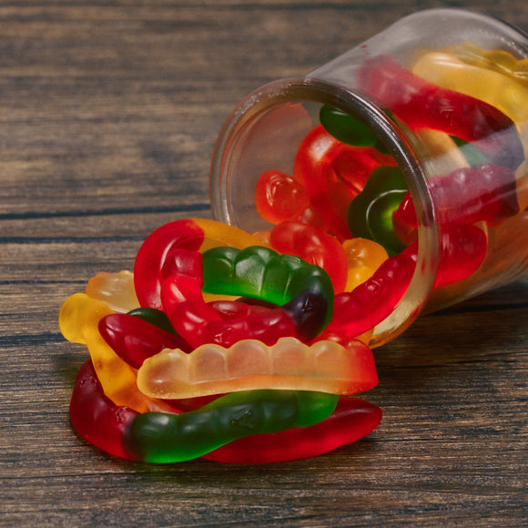 a half pound bag of fruit flavored gummi worms.
