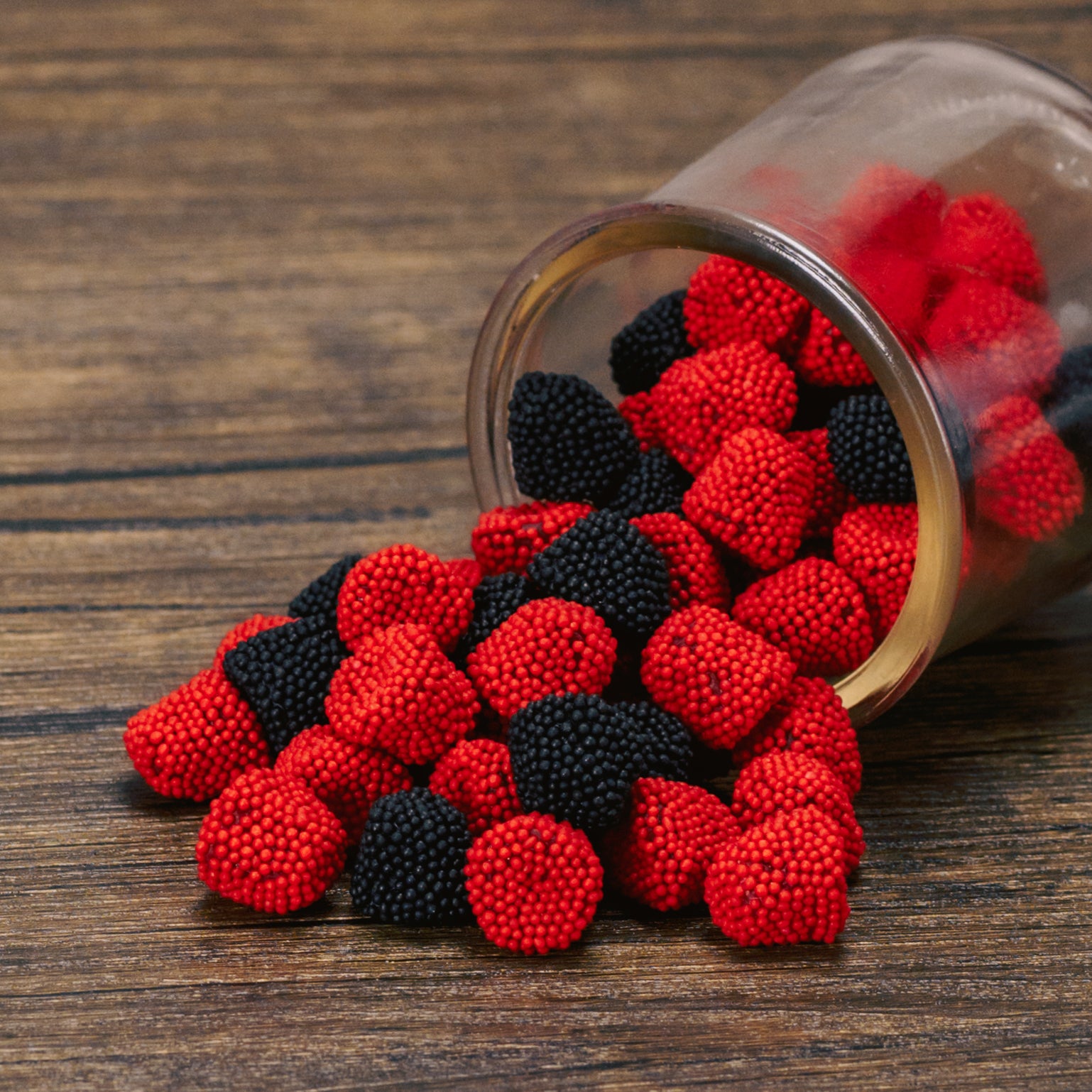 red raspberry and black blackberry bite-sized gummies in a half pound bag - with nonpareil sprinkles.